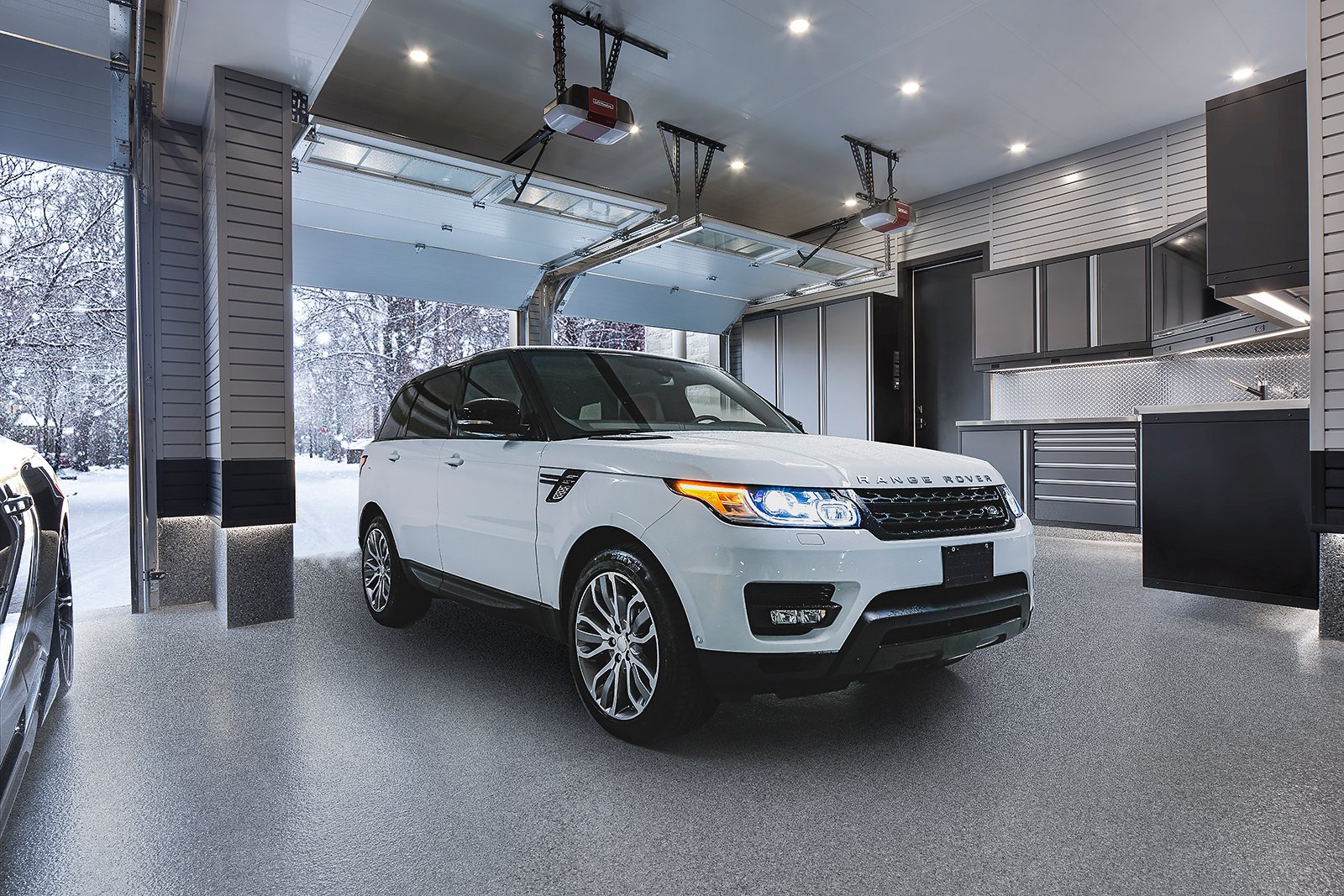 garage in winter with white Range Rover