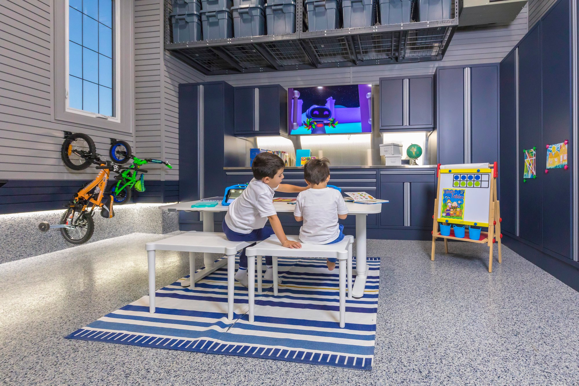 Kids learning and enjoying the garage by Garage Living