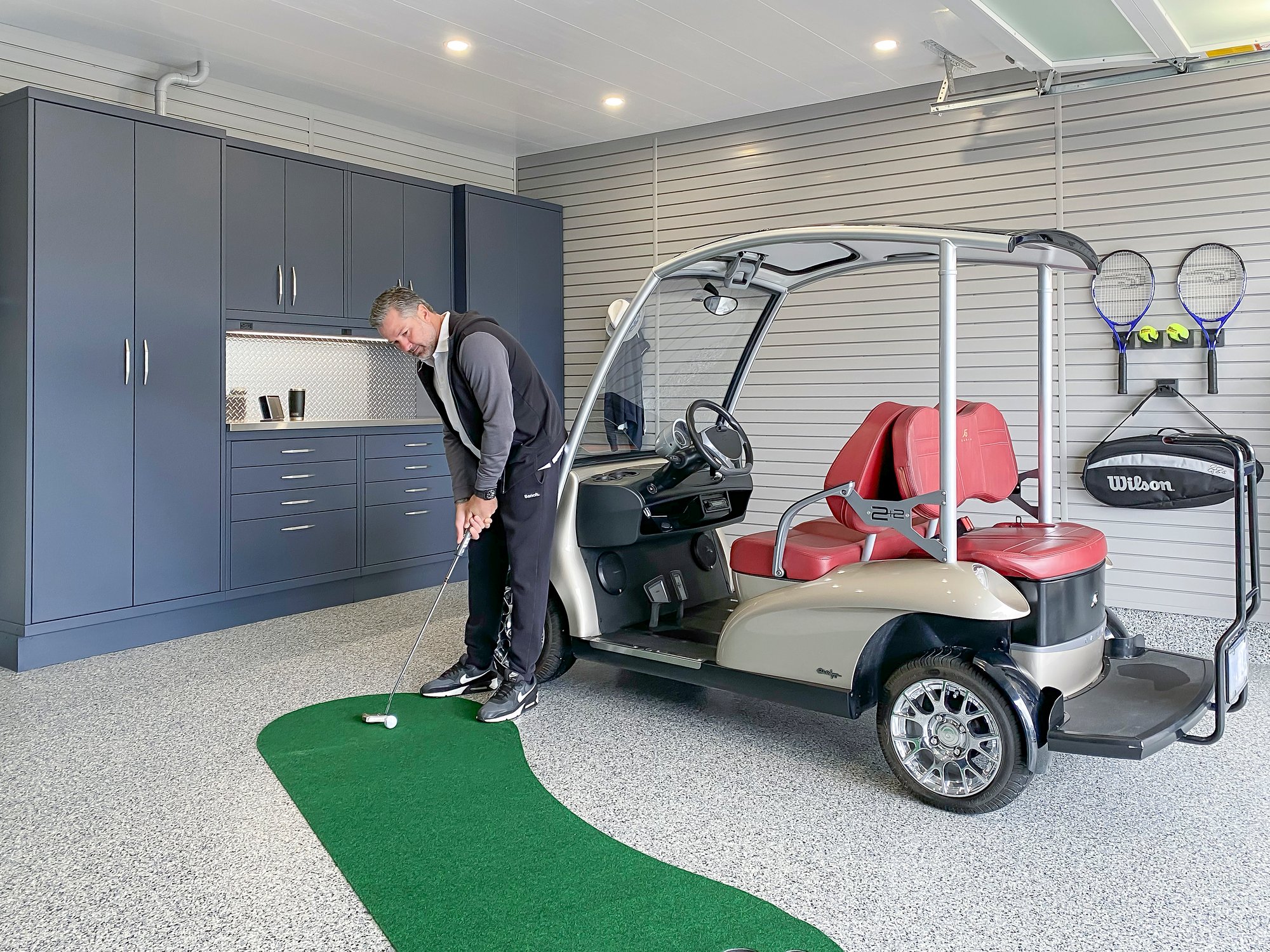 Golf in the garage by Garage Living