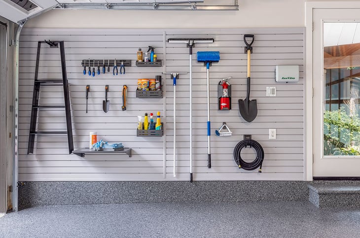 Use garage slatwall panels for tool storage - Garage Living