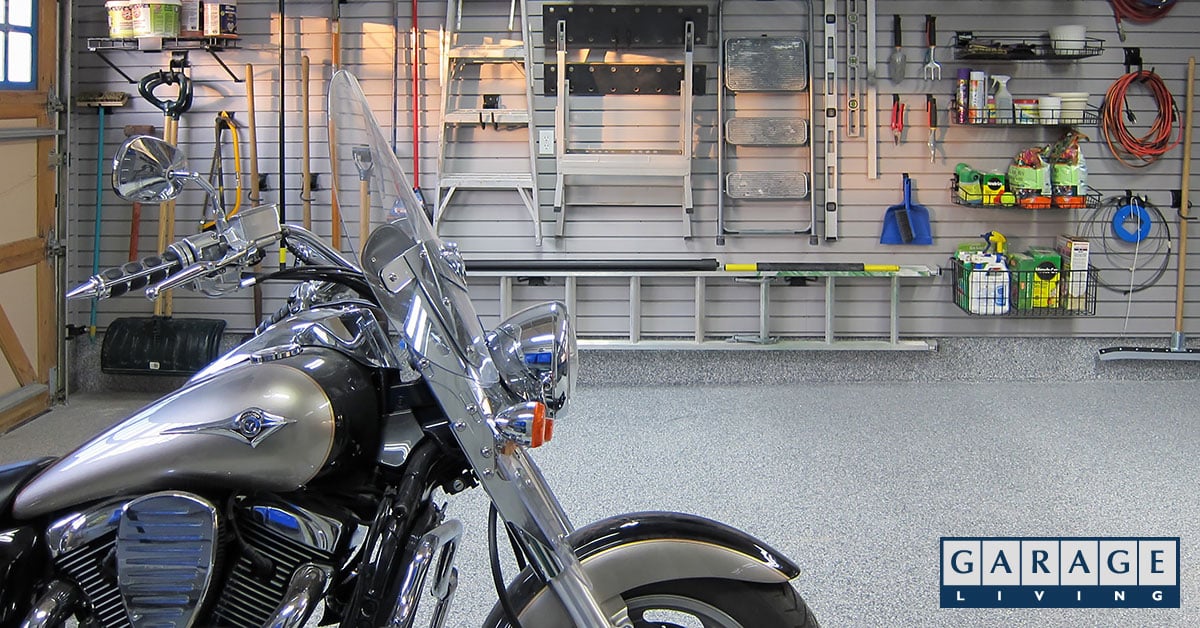motorcycle and items hung on garage wall