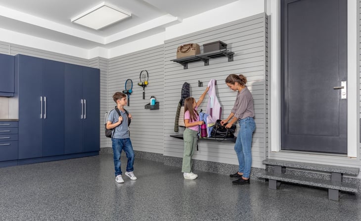 A family uses garage organization tools to keep a clean garage