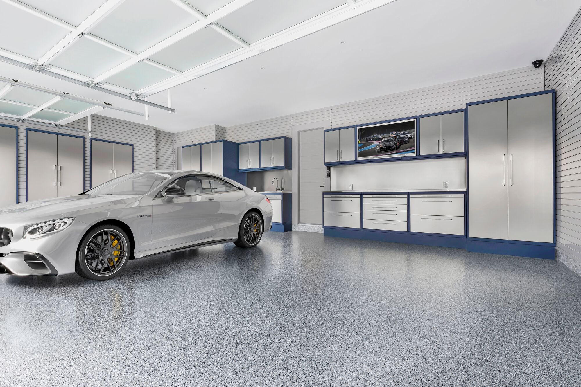 Luxury Garage with car by Garage Living
