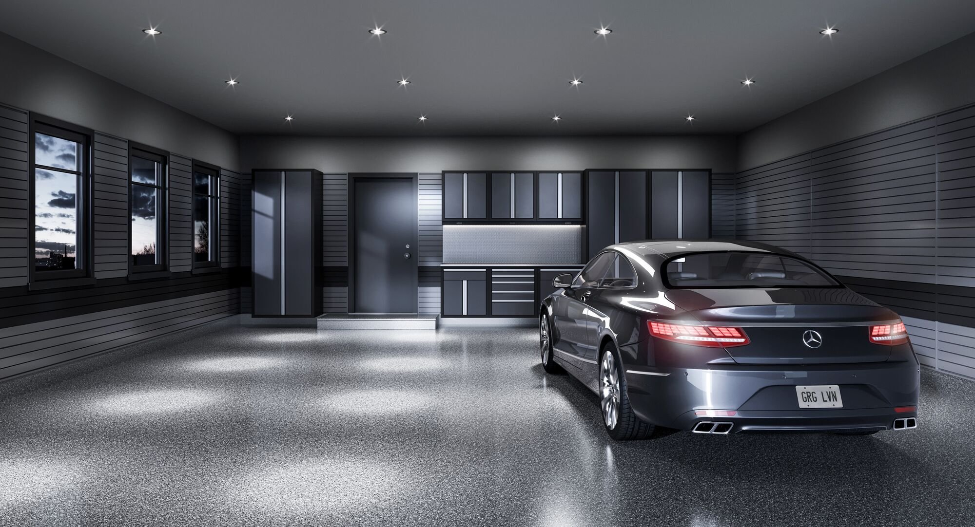A freshly and professionally renovated garage showcases our stunning cabinetry and slatwall design.