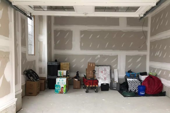 Unfinished large single car garage before