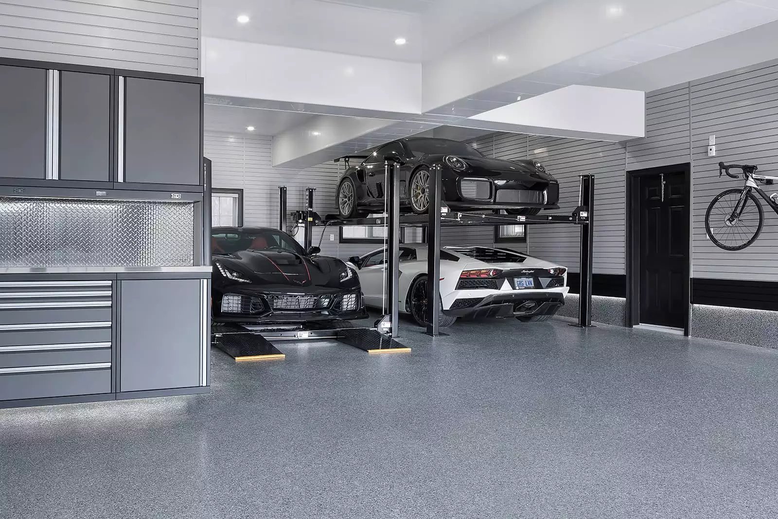 Wide shot of Double car lift garage by Garage Living