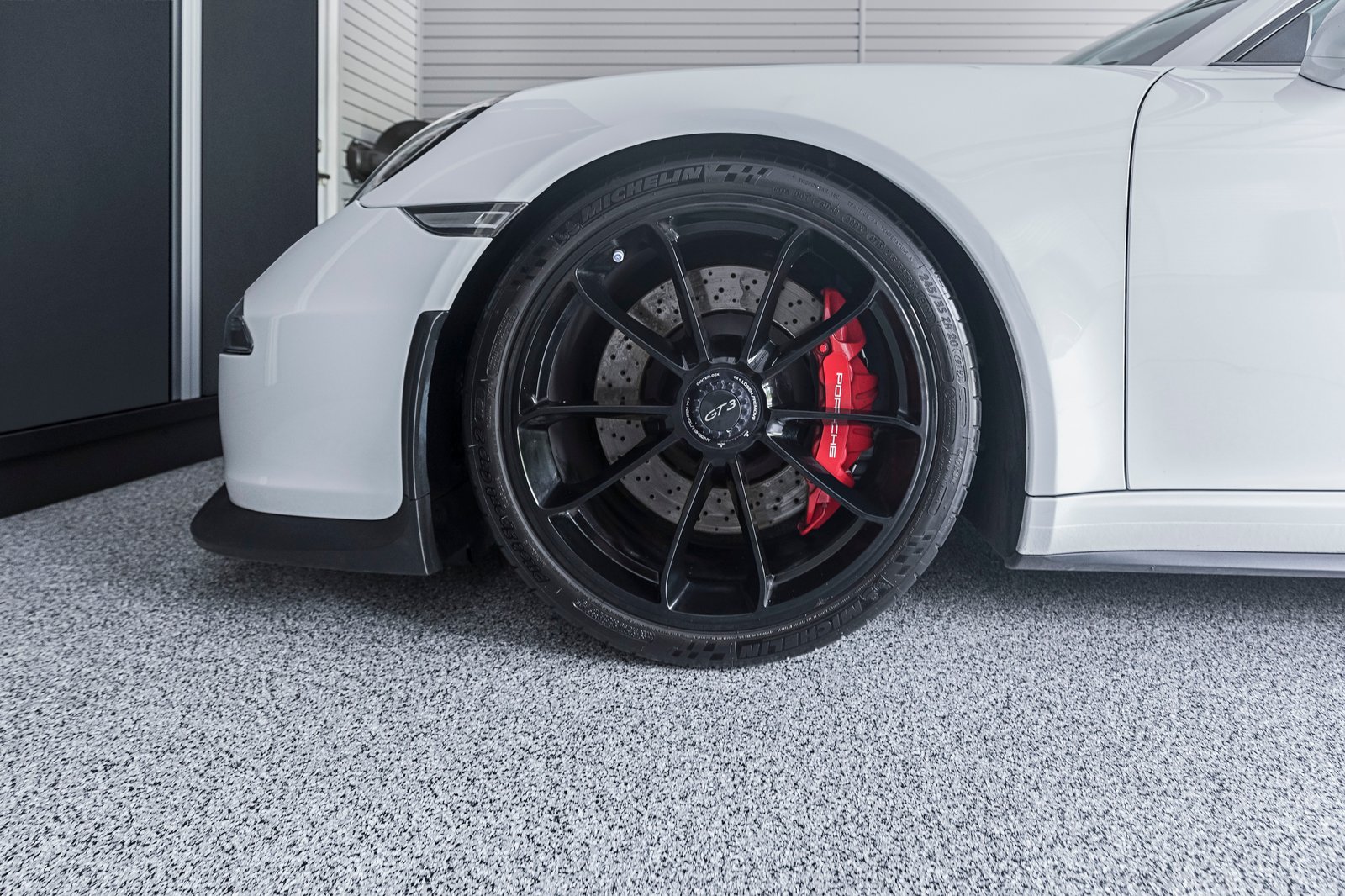 Floortex floor coating with Porsche gt3 michelin wheel focus - Garage Living