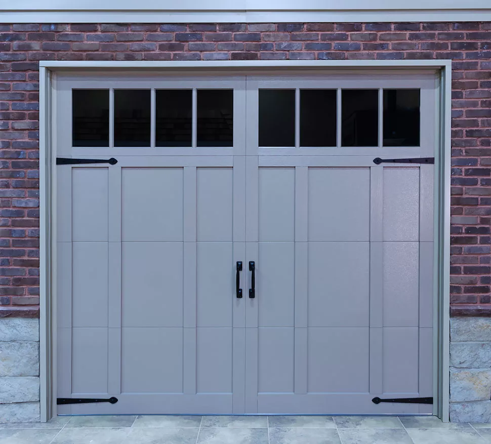Carriage House Steel overlay garage door with decorative hardware - Garage Living